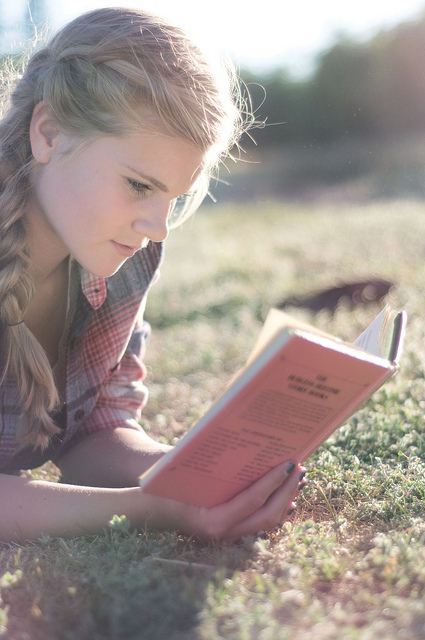 A girl reading a book.
