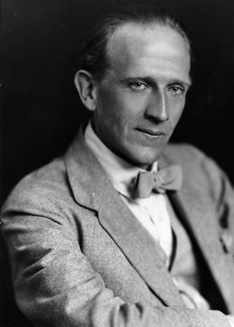 Headshot of author A A Milne
