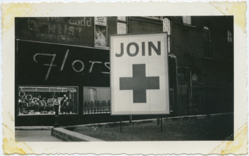 Historic photo of a large sign that reads "Join +" in downtown Nashville.