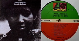 Aretha Franklin’s "Spirit in the Dark" album cover alongside its Atlantic Records vinyl label, featuring a green, white, and orange design.