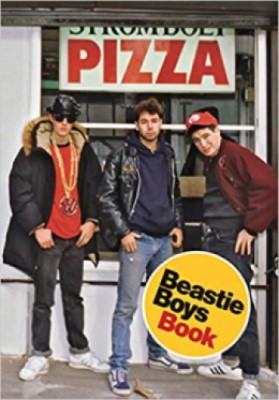 Book cover for the Beastie Boys Book showing three young men in front of a pizza shop.