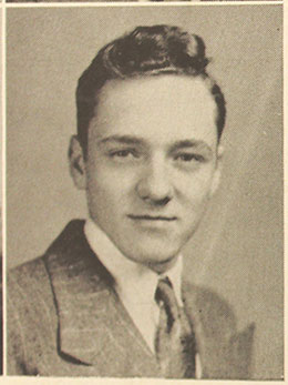 Black and white photo of a man in a suit.