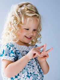 child counting on her fingers