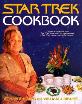 The cover of the "Star Trek Cookbook" by Ethan Phillips and William J. Birnes, featuring Neelix standing by a table of alien-looking dishes.