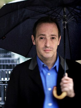 A man holding an umbrella.