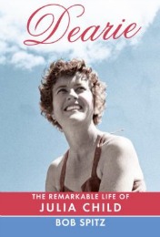 Book cover for "Dearie: The Remarkable Life of Julia Child" by Bob Spitz, featuring a young Julia Child smiling against a blue sky.
