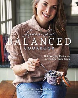 Book cover depicts woman in sweater and jeans stirring a jar of yogurt, sitting in a bright kitchen.