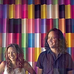 Two people posed smiling.