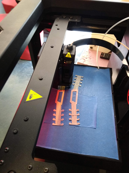three d printer creates flat masks.