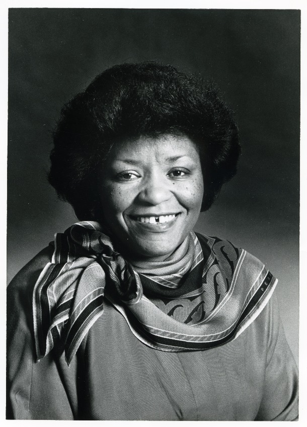 portrait of woman wearing decorative scarf.