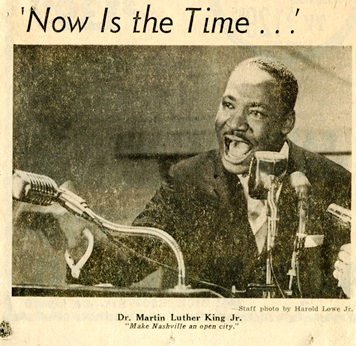 newspaper clipping shows black man in suit speaking with multiple microphones. captioned now is the time.