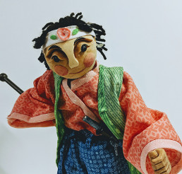 marinette figure is dressed in orange and green Japanese clothing.