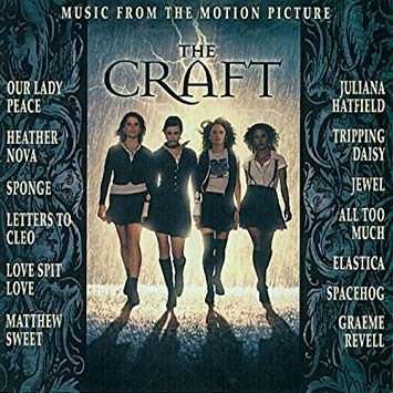 Music album cover features four young women in miniskirts. Names of bands in two columns.