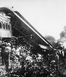 Black and white photo of a train wreck.