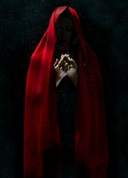 Image of a dark figure in a long red cloak. Only the hands are visible.