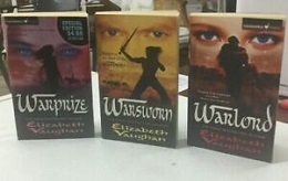 Three books lined next to each other with titles Warprize, Warsworn, and Warlord.
