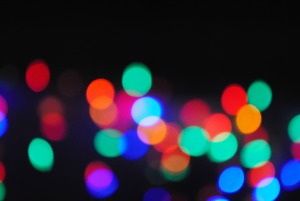 Colorful orbs of light on black background.