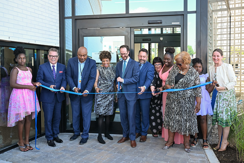 A ribbon cutting at the library with Mayor O'Connell and others.