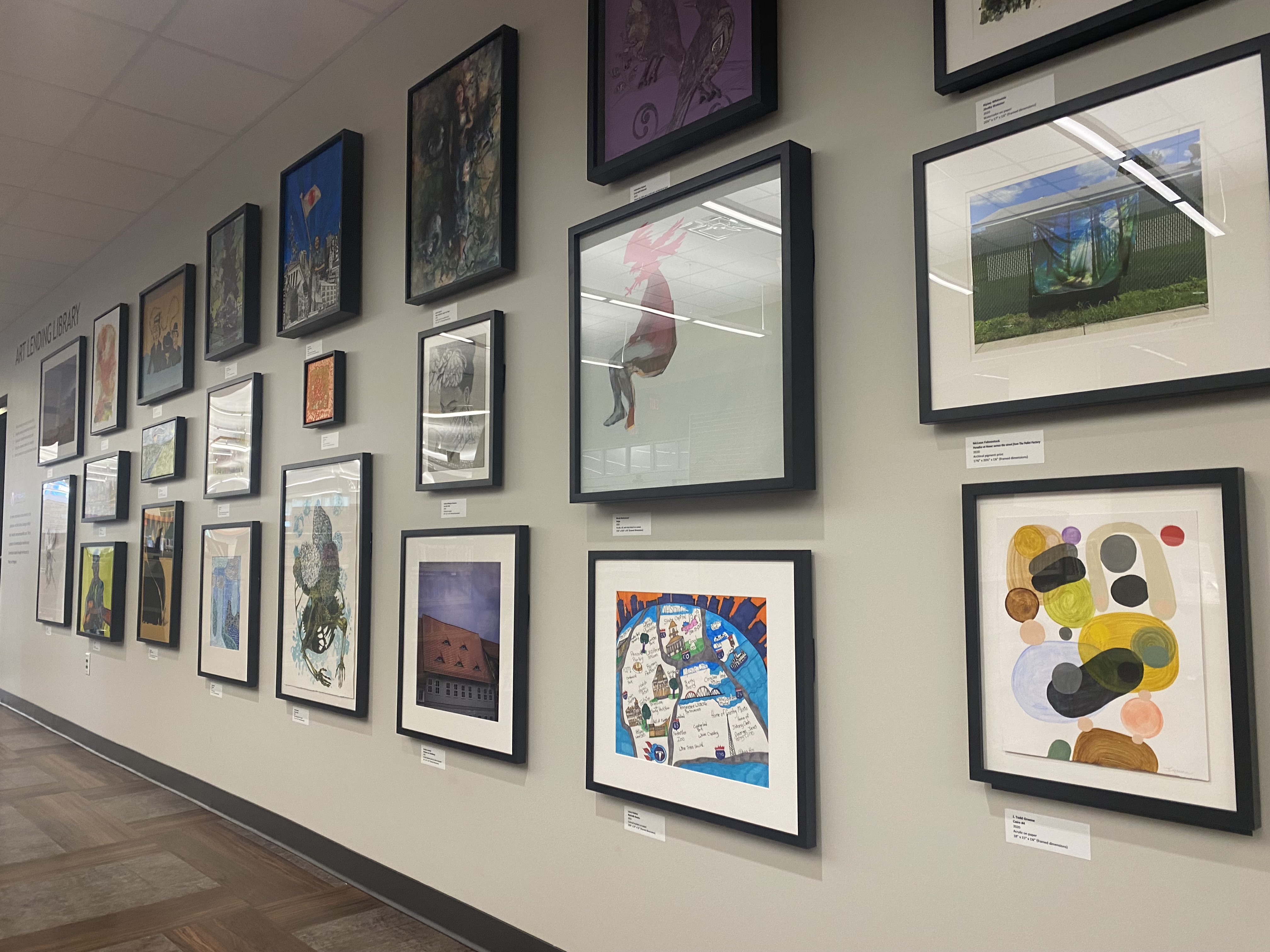 Photo of a wall with framed art.
