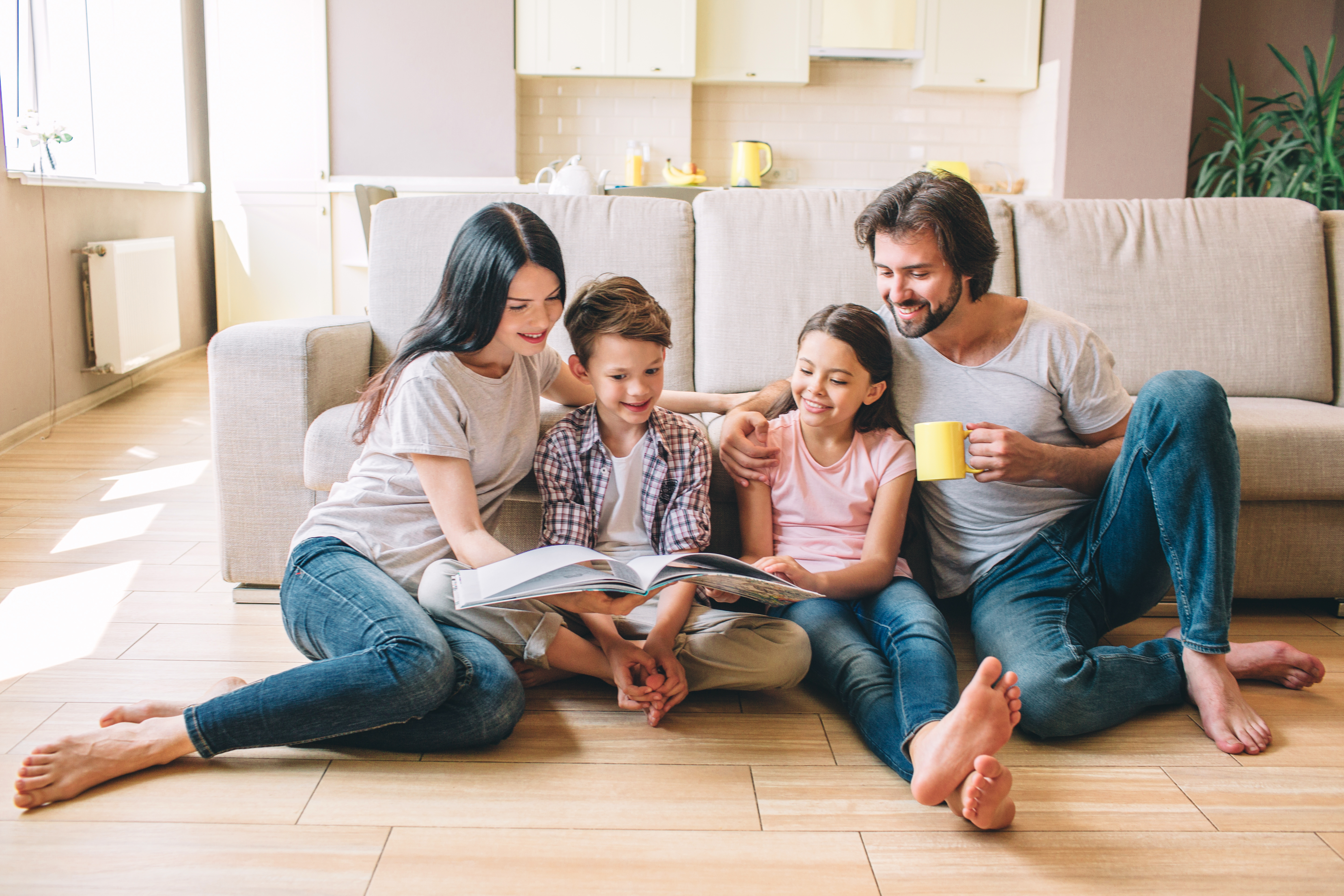 Family reading in morning in bare feet