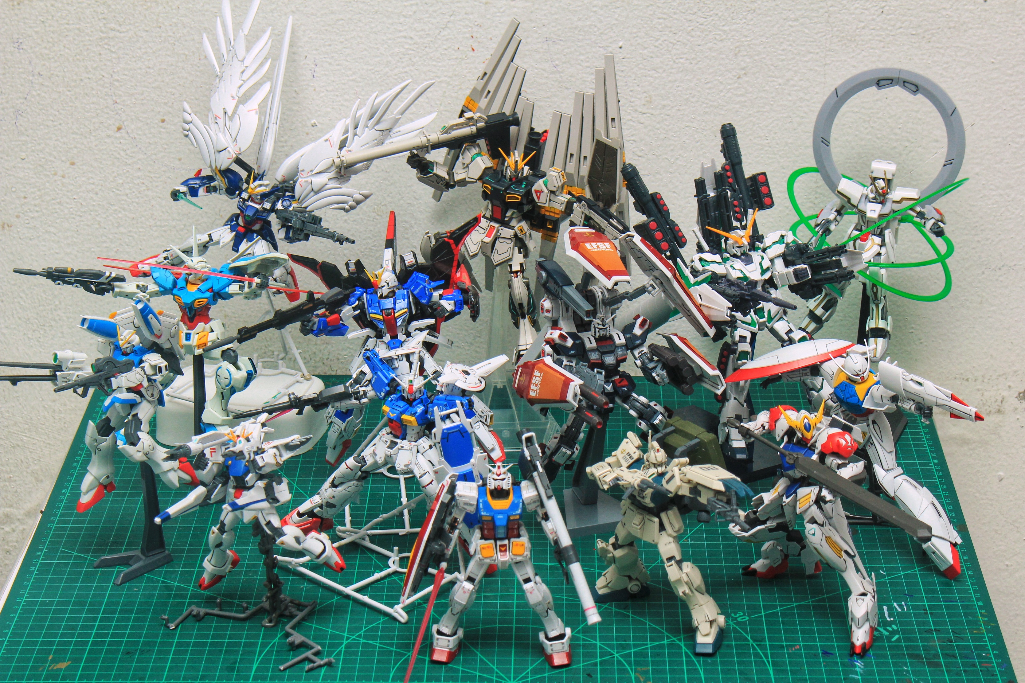 A group of many Gunpla action figures. 