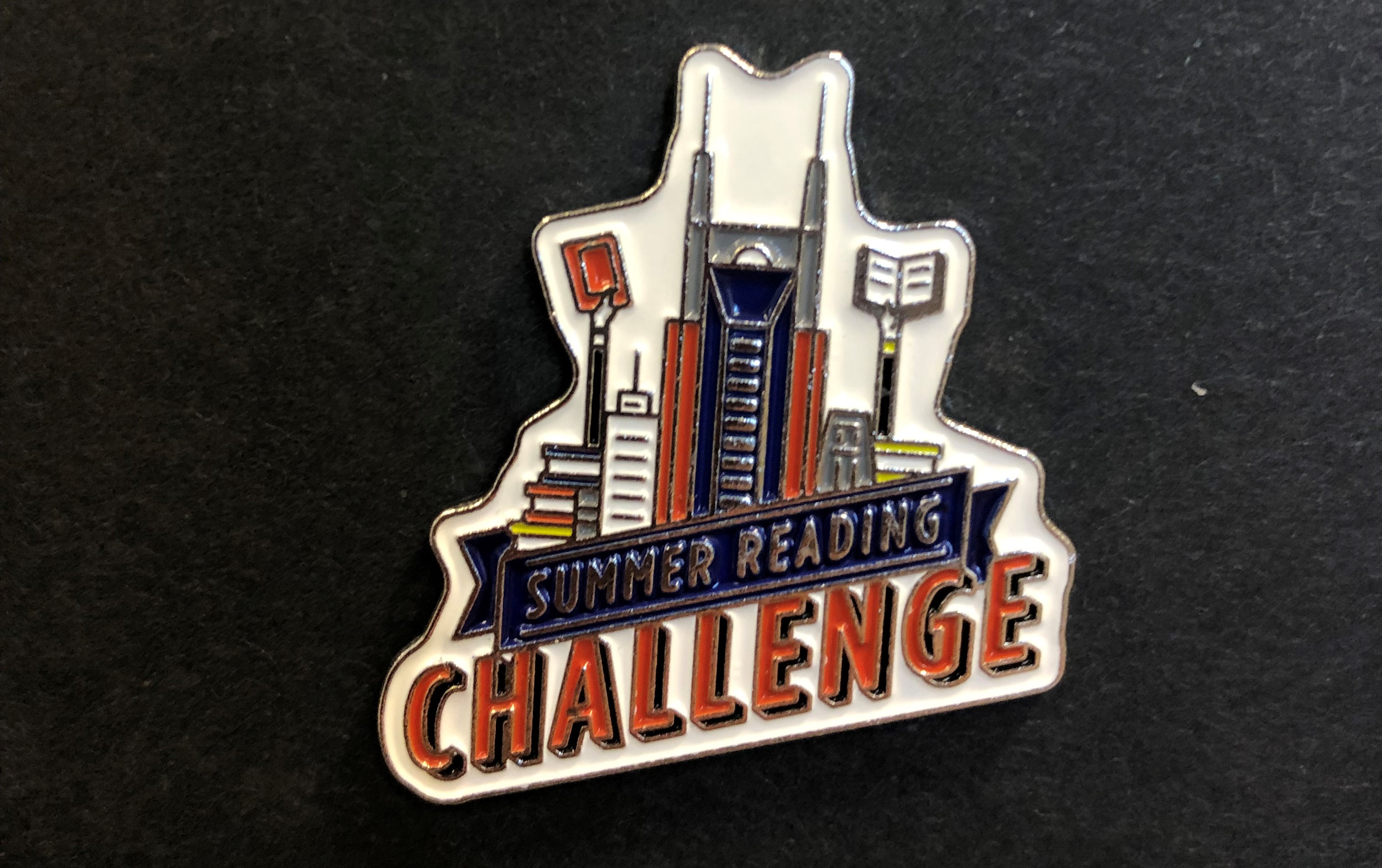 Summer Reading Challenge enamel pin showing the Nashville skyline