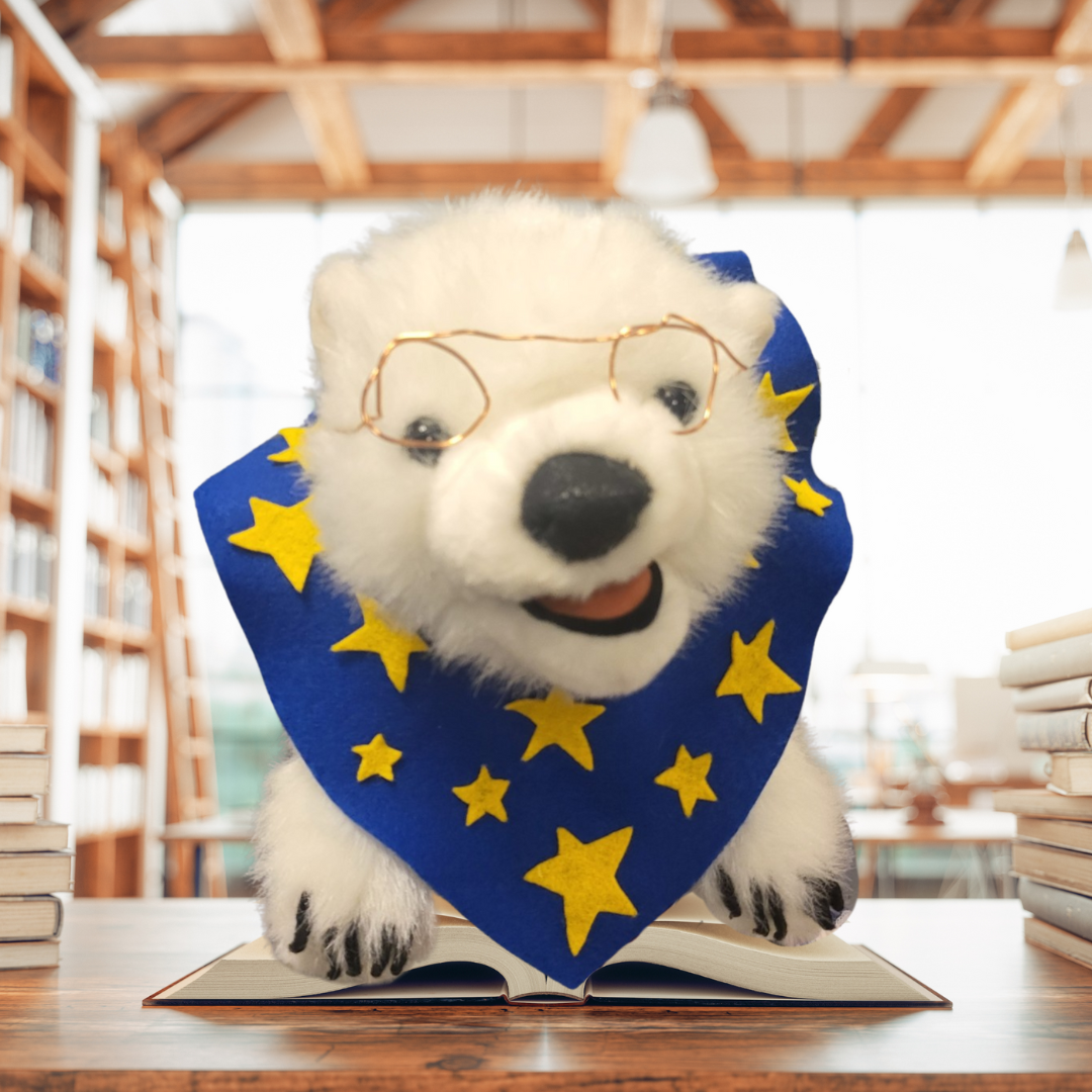 Polar bear stuffed animal toy wearing a blue bandana with a yellow star design.