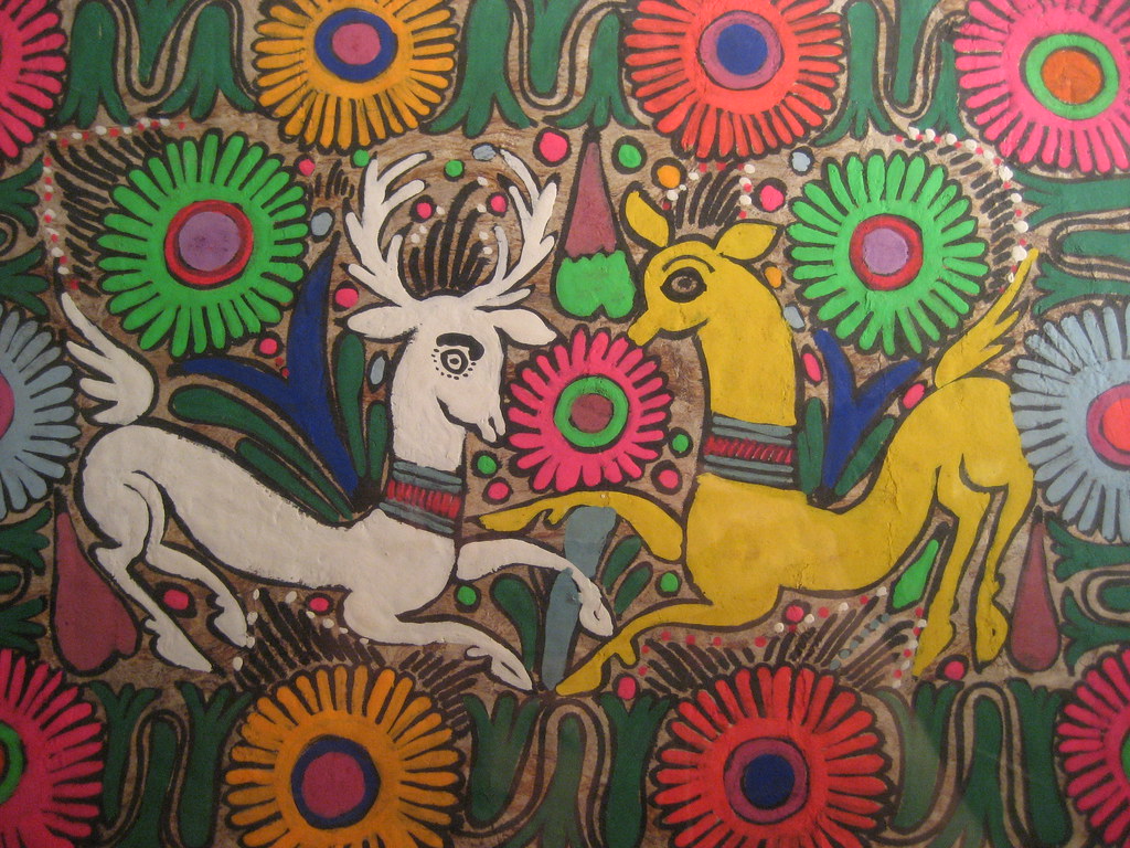 Colorful artwork featuring two stylized animals and flowers.