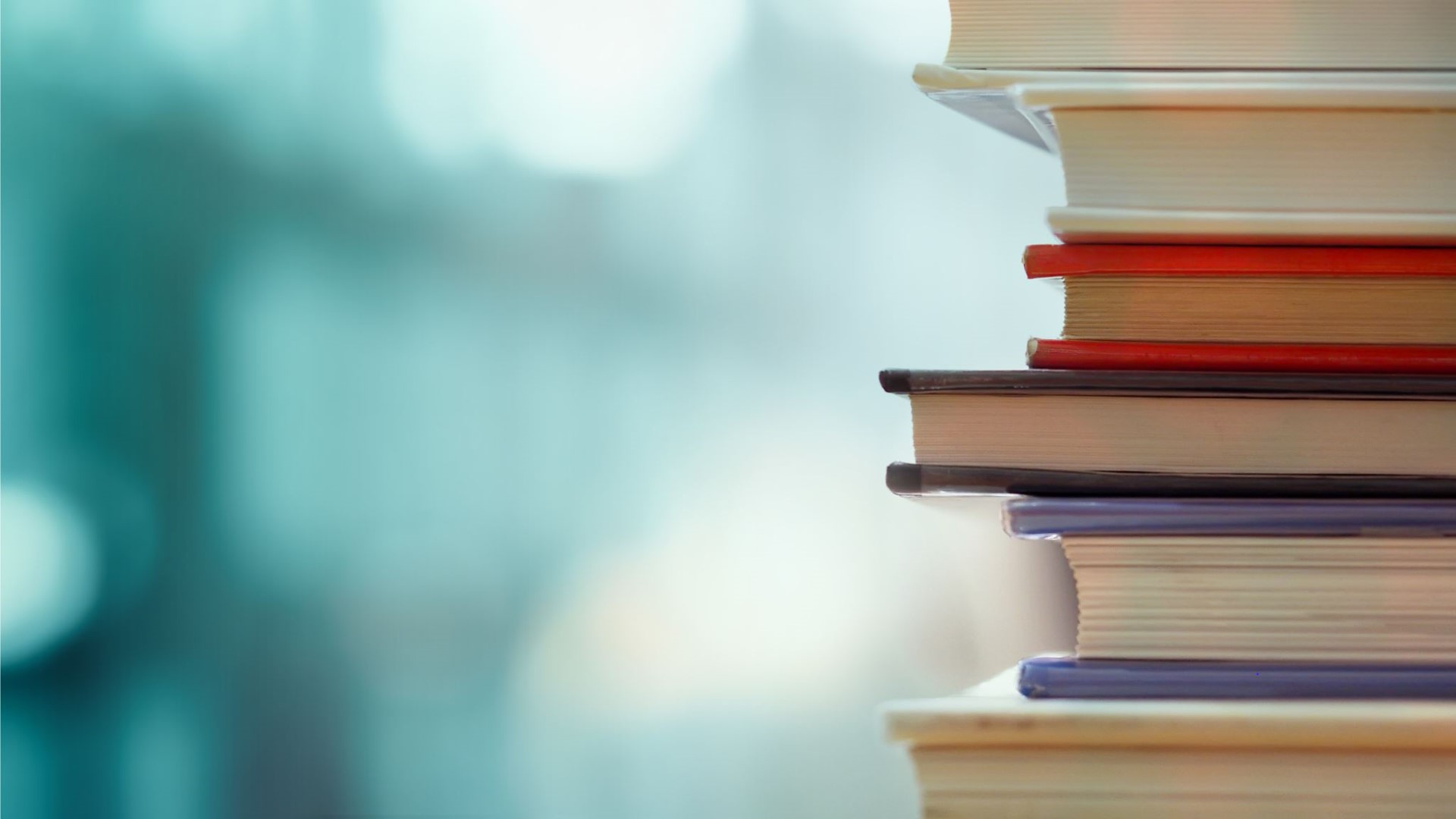 Stack of hardcover books.