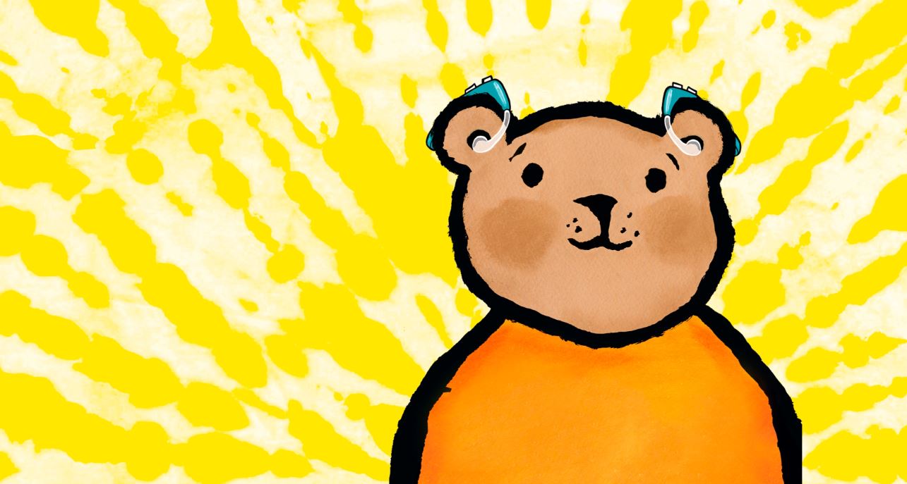Cartoon drawing of a bear in an orange shirt with hearing aids or headphones in.