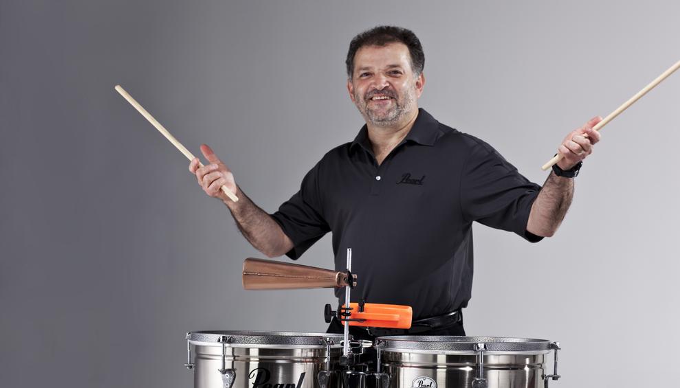 Photogaphy. Man holding drum sticks.