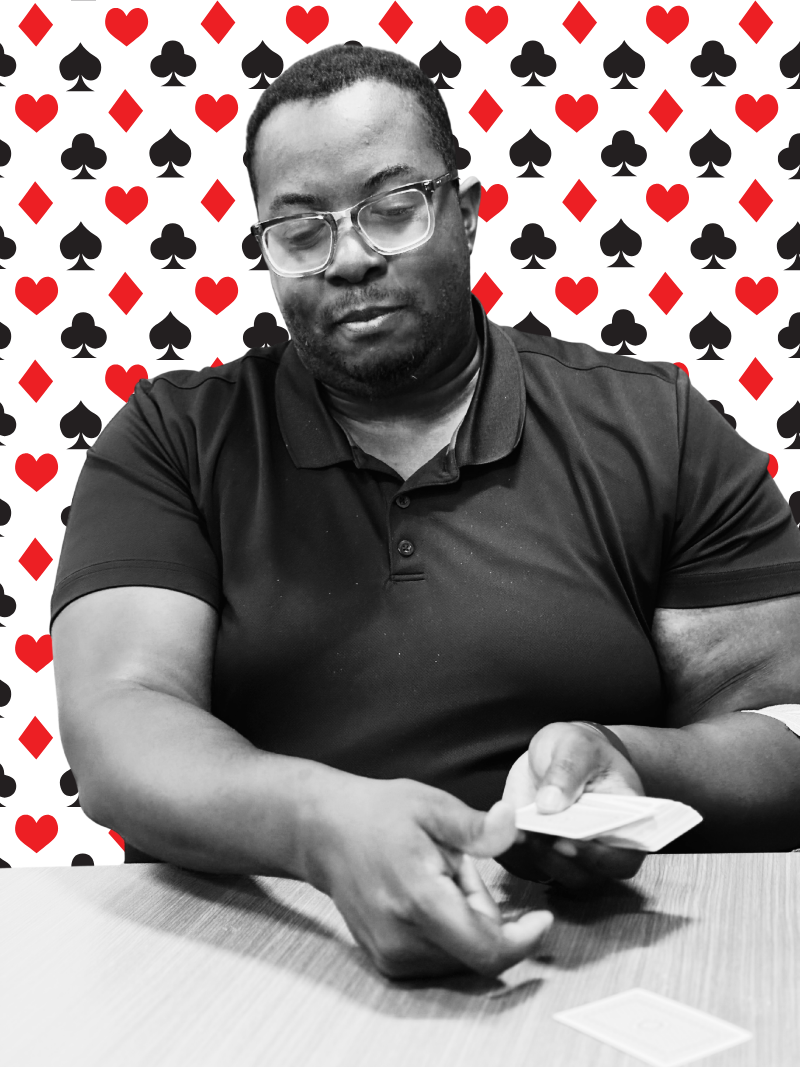 Photograph. Man dealing cards.