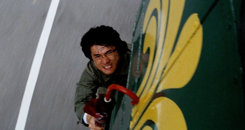 Jackie Chan clings to a speeding bus