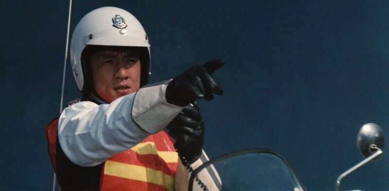 Jackie Chan in full traffic cop uniform