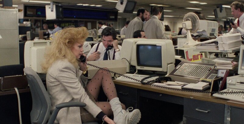Melanie Griffith at her desk