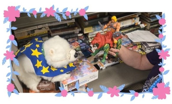 Kipp, right, showing Vanilla, left, an action figure 