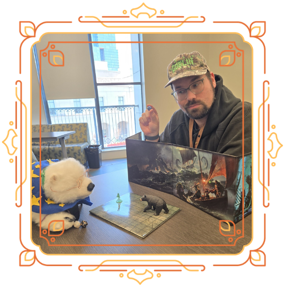 Andrew, right, showing Vanilla, left, a D20