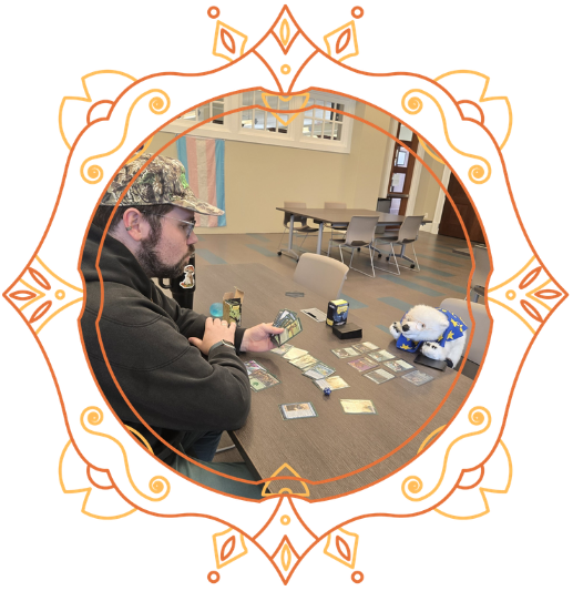 Andrew, left, playing Magic the Gathering against Vanilla, right