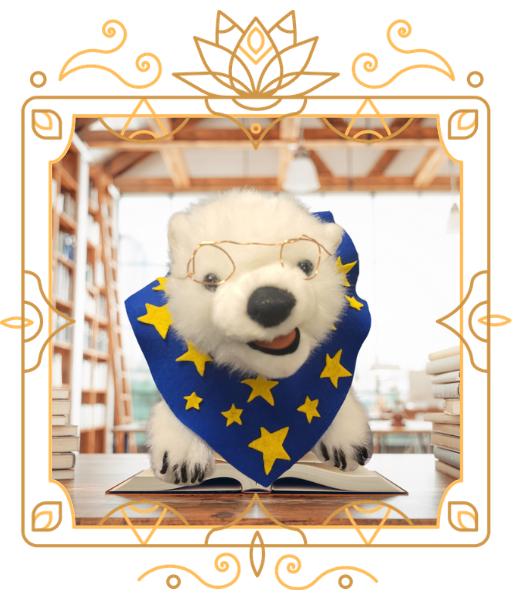 Vanilla, a polar bear, sitting on a book in a frame 