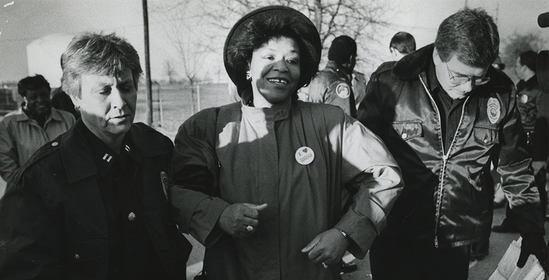 Photo of Thelma Harper with a police office on either side of her, during her arrest in Nashville on February 19, 1990
