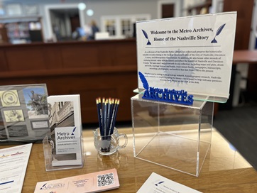 Photo of documents on display table in metro archives