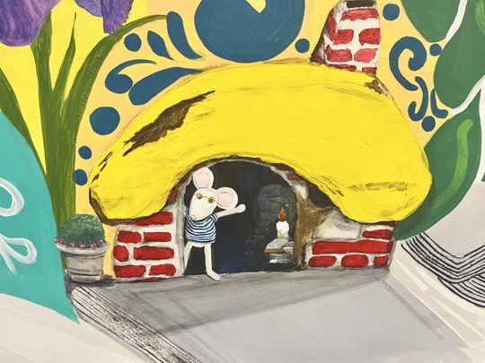 Toy mouse named Buttercup standing outside his tiny brick house at Main Library.