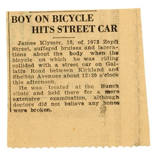 News clipping about boy hitting street car with bicycle.