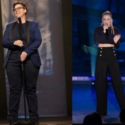 Two female comedians on stage.