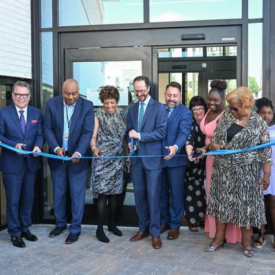Mayor O'Connell with dignitaries cutting a ribbon.