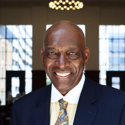 Headshot of a man in the grand reading room.
