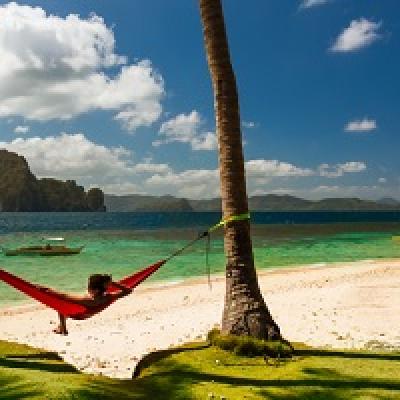 Person in hammock on an island.