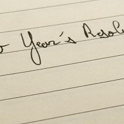 Paper with "new years resolutions" written at the top.