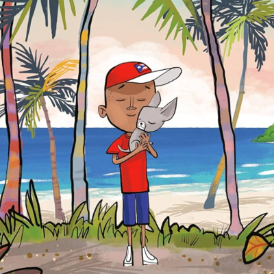 Boy wearing hat with Cuban flag holding a small dog on an island.