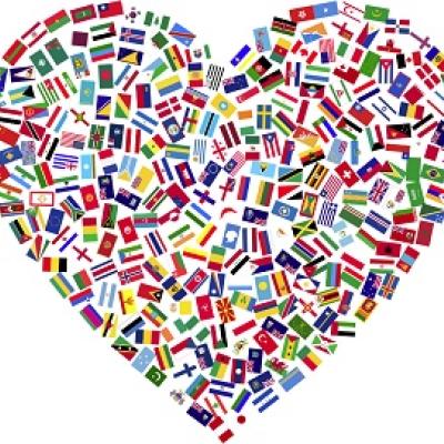 Heart made up of a collage of world flags.